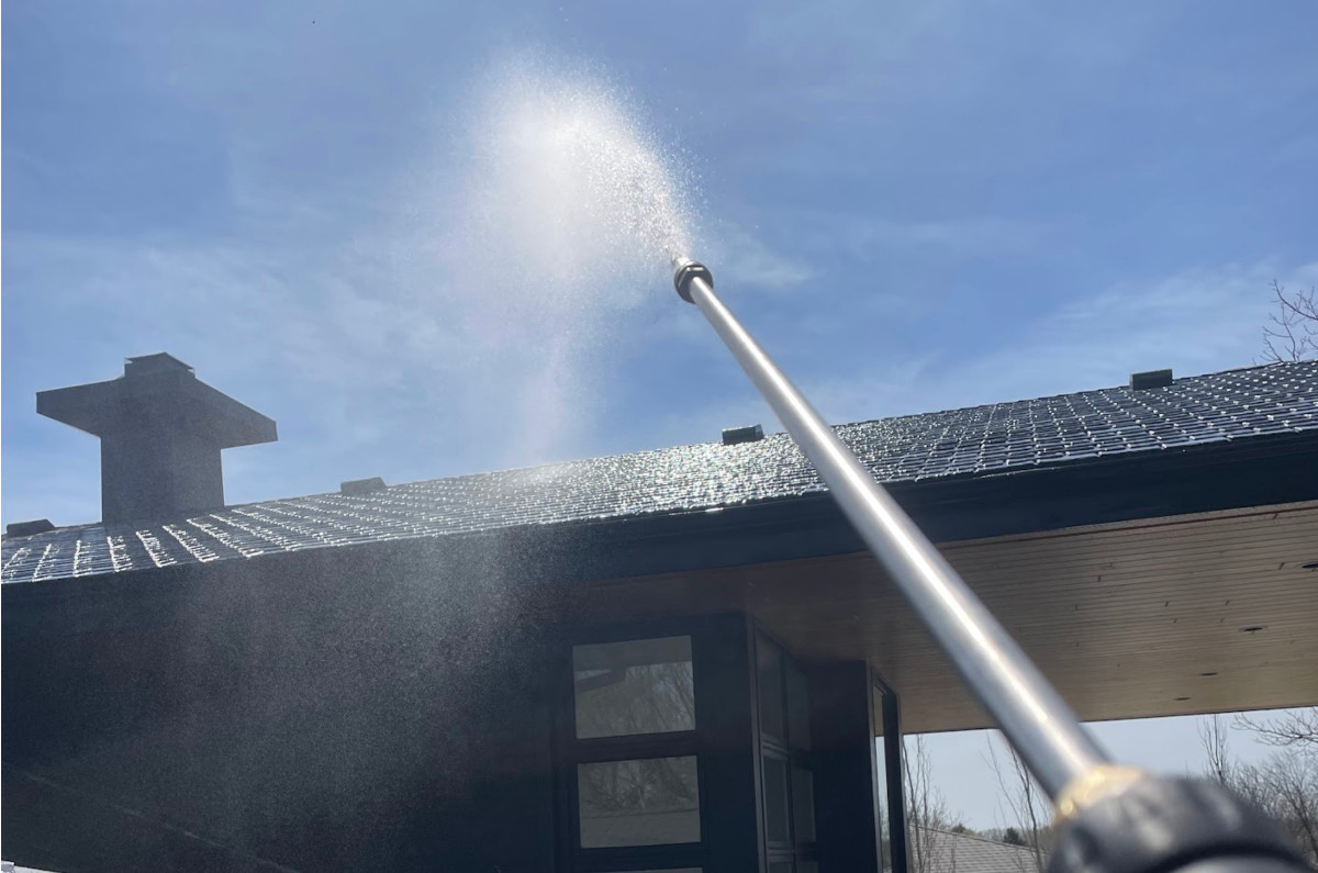 House being pressure washed, soft washed